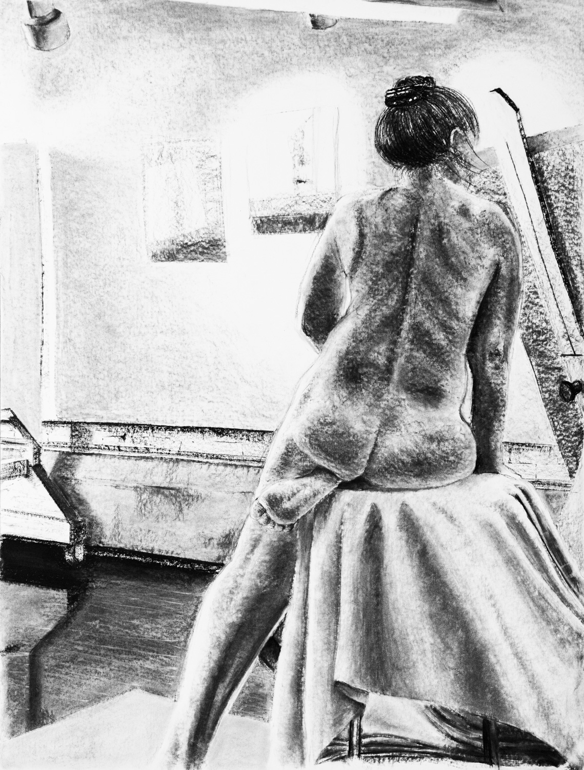 Large charcoal drawing of the back of a sitting nude figure.