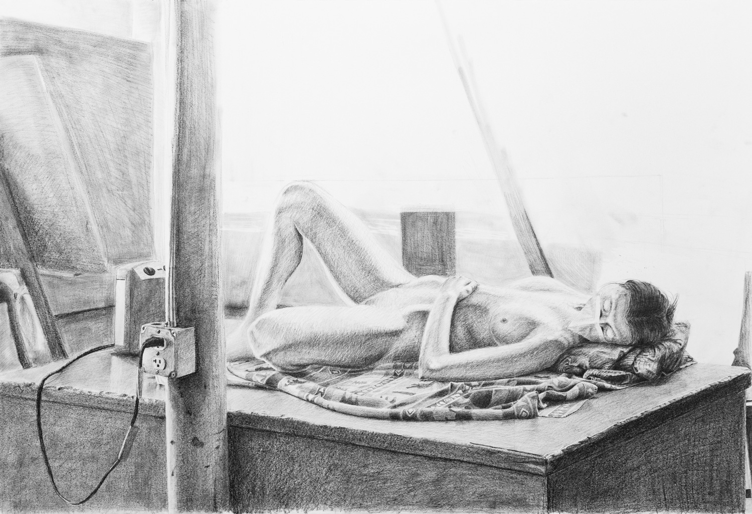 Large graphite drawing of a nude figure lying on an elevated surface.